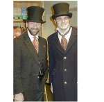 Michael Hovde, who greeted guests as a Dickensian figure at a book signing, poses with Gerald Dickens